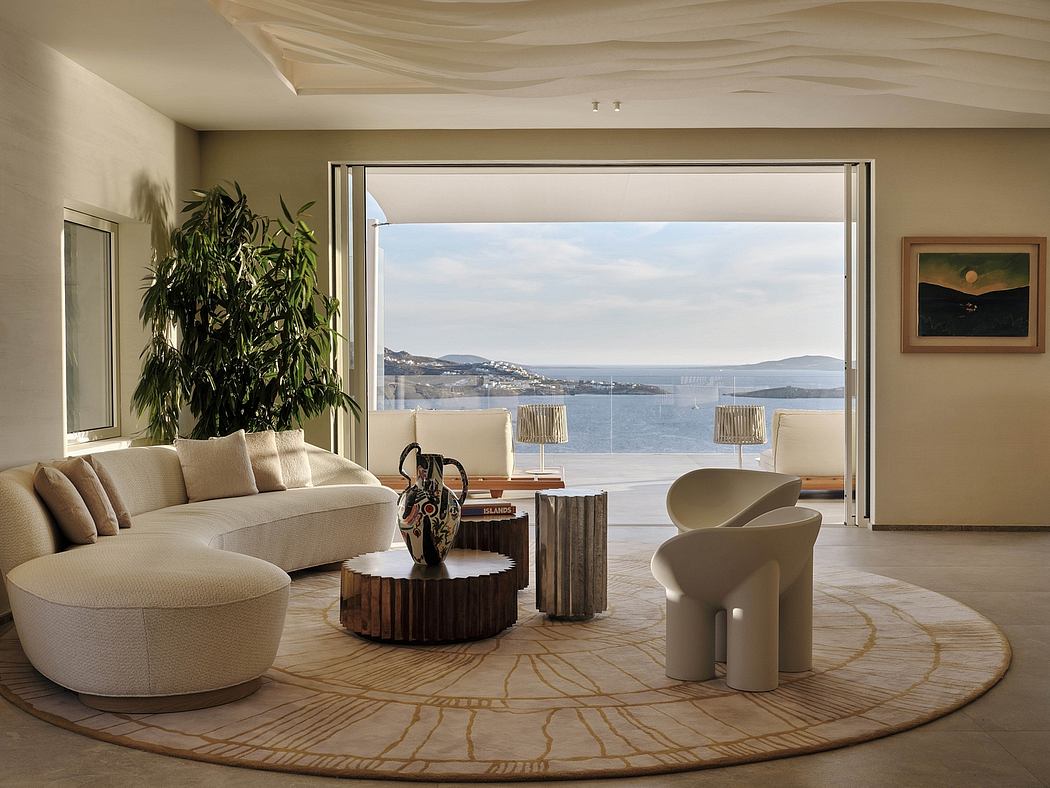 Luxurious seaside living room with floor-to-ceiling windows, plush seating, and natural decor.