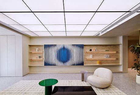 Sleek, modern office space with wood paneling, geometric artwork, and minimalist furnishings.