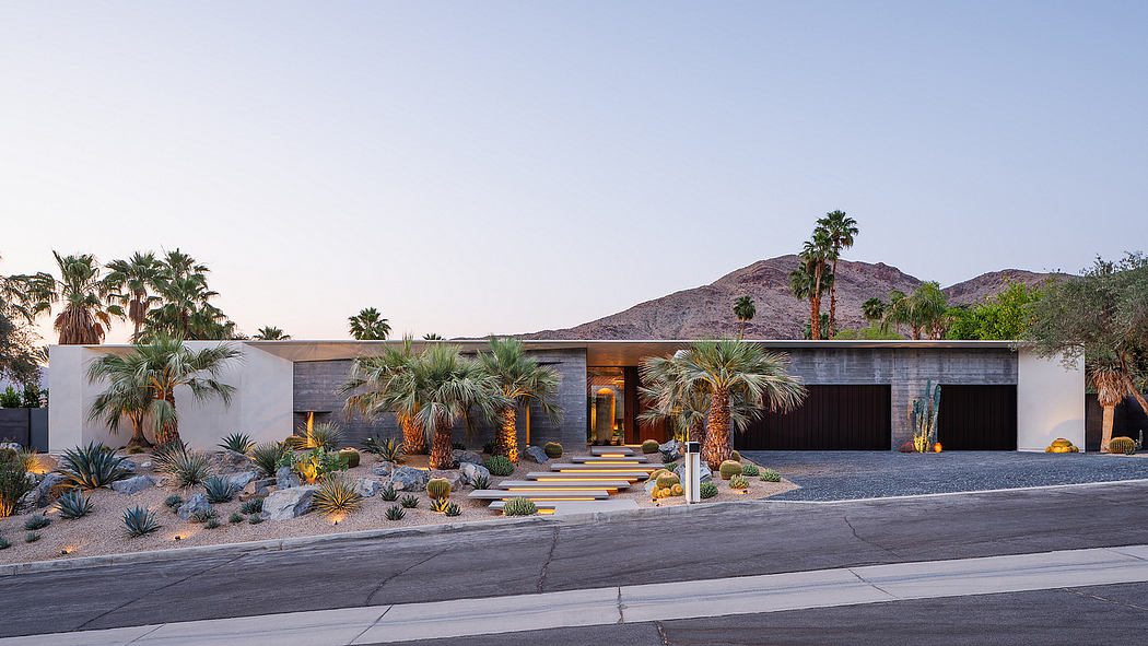 Sleek, modern desert oasis with lush cacti, palms, and dramatic mountain backdrop.