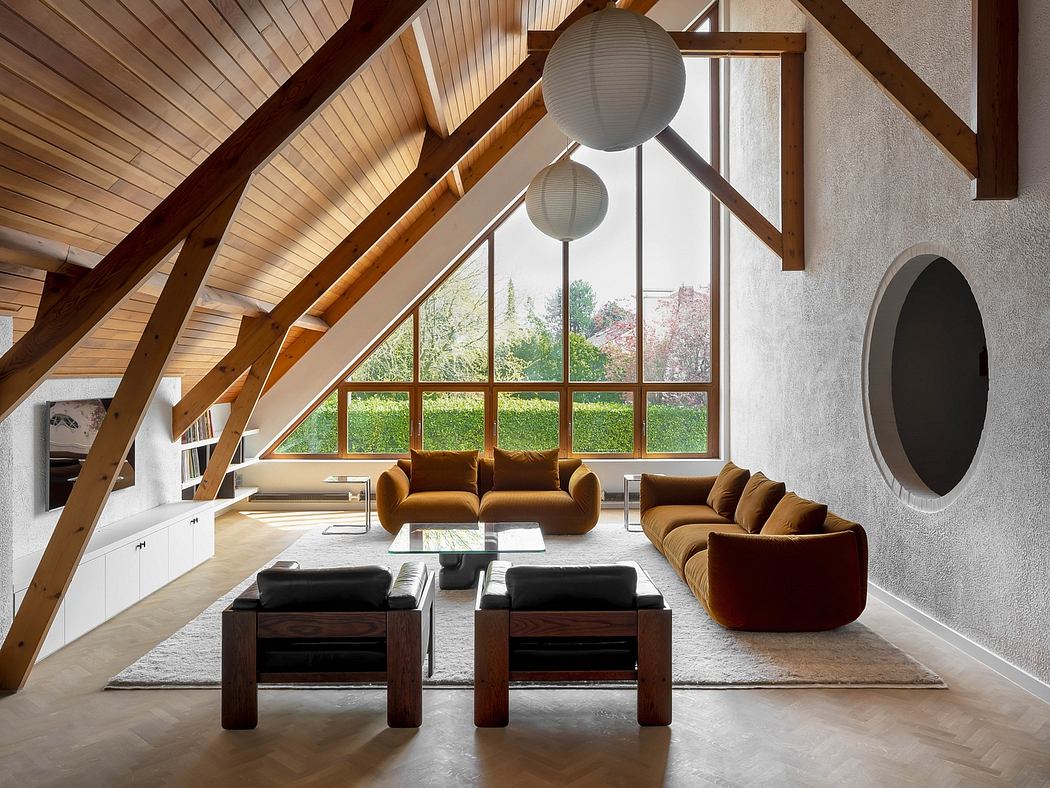 Rustic yet modern living room with wooden beams, large windows, and plush seating.