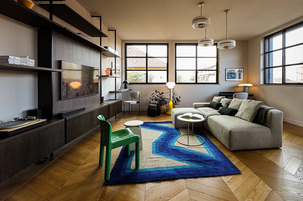 Contemporary living room with sleek shelving, plush sofa, and vibrant blue rug.