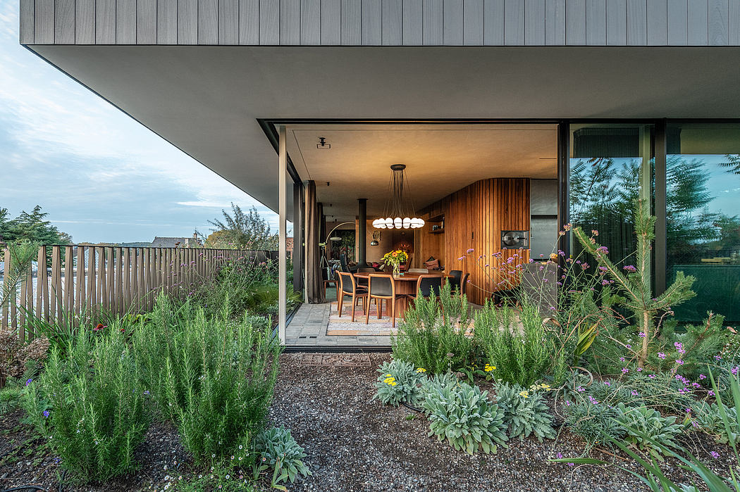 Sleek modern home exterior with warm wood accents and lush landscaping.