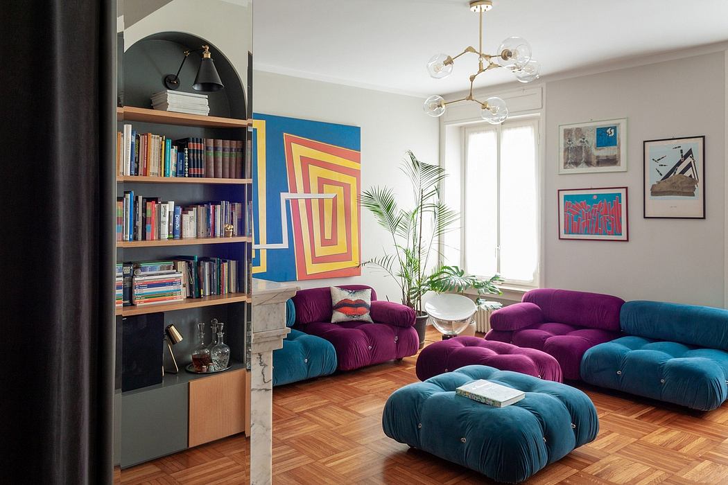 Vibrant, eclectic living room with geometric wall art, plush sofas, and a statement chandelier.