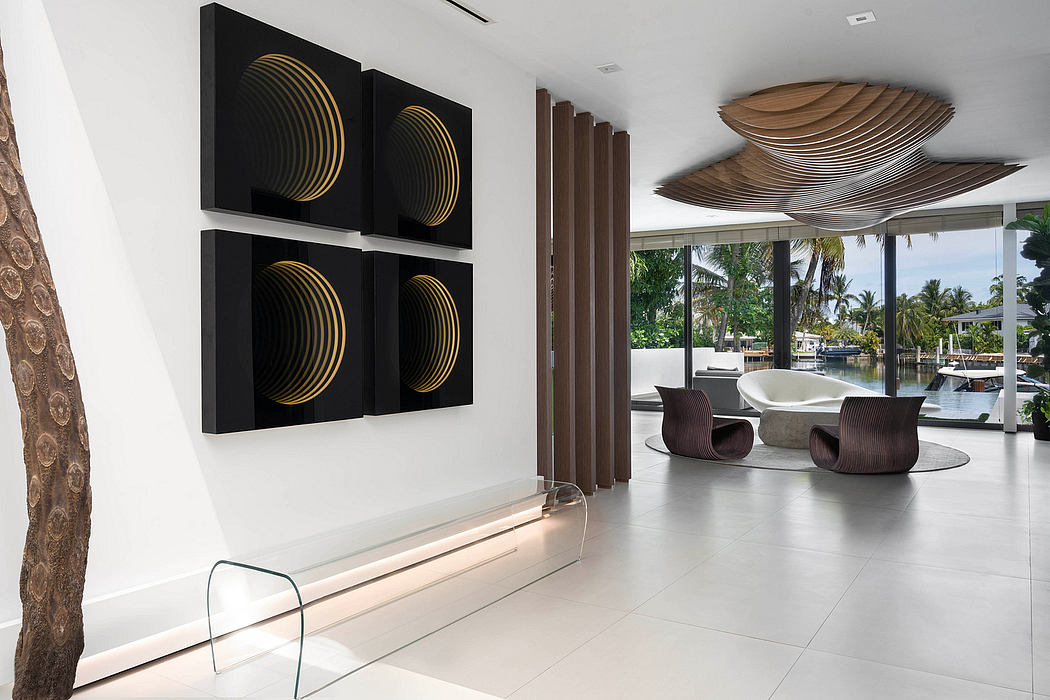 Luxurious modern interior with geometric wall art, curved seating, and scenic waterfront view.