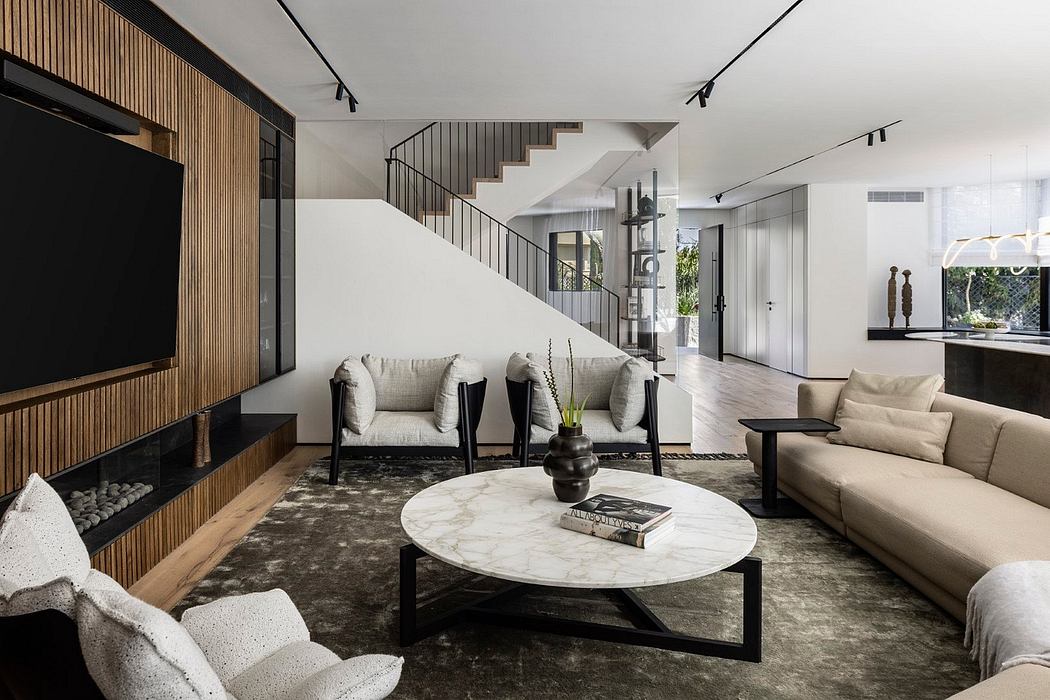 A modern, open-concept living space with a large marble coffee table, plush sofas, and a prominent wooden accent wall.