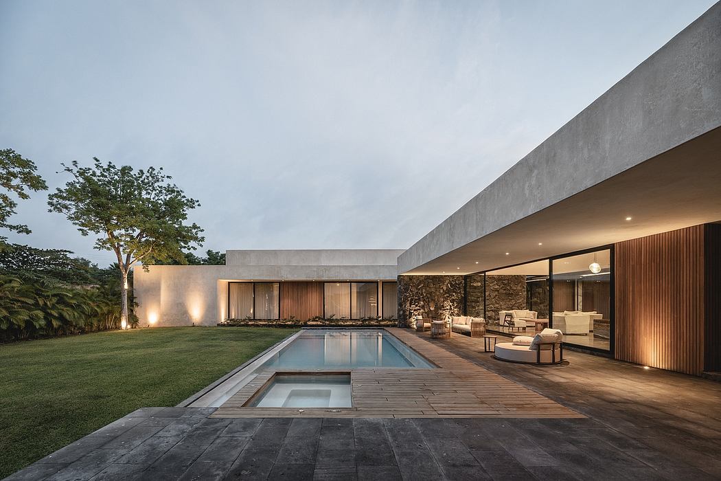 Sleek, modern architecture with clean lines, a pool, and a cozy patio area.