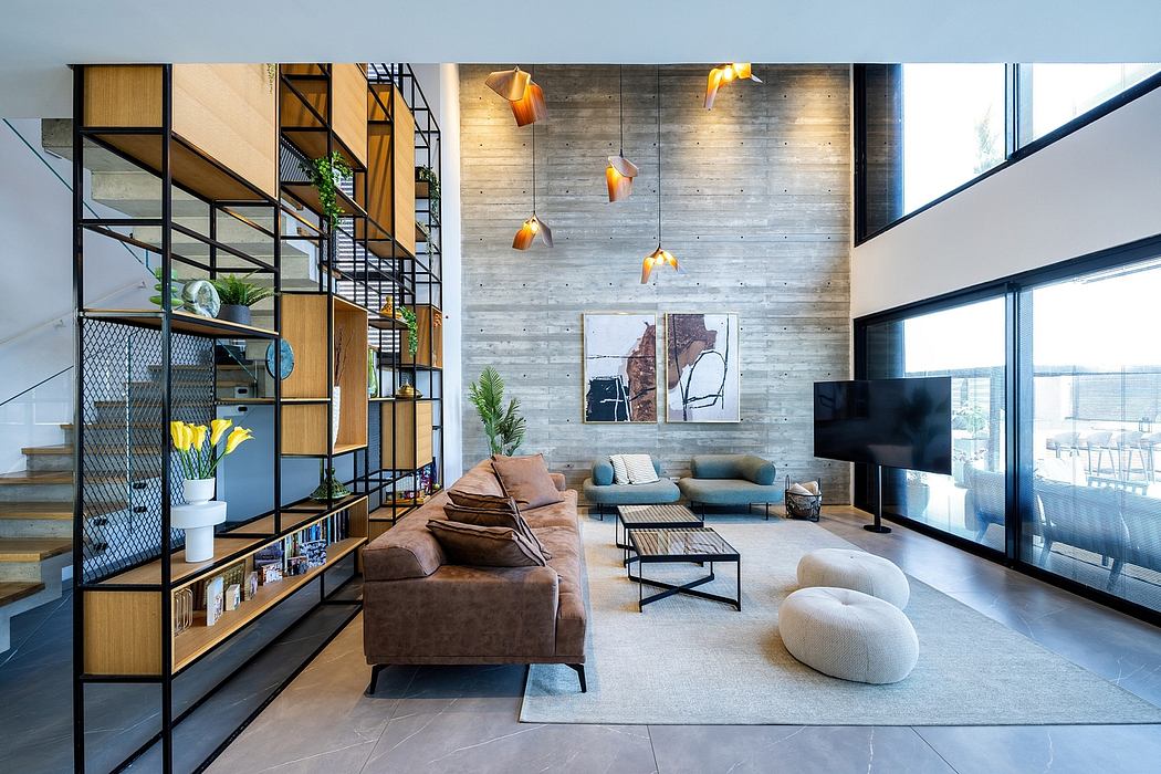 Spacious living room with industrial-style shelving, concrete walls, and modern lighting.