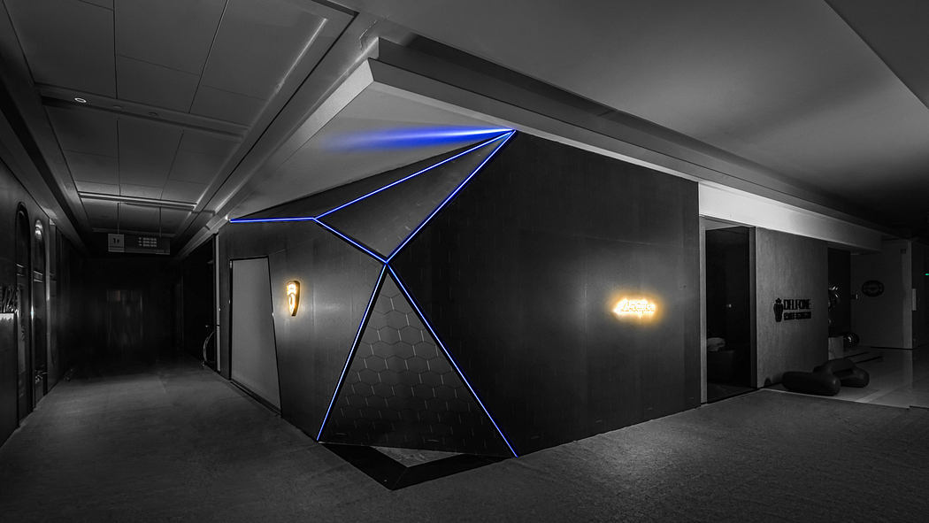 A modern, dark-themed corridor with striking geometric lighting design and architectural elements.