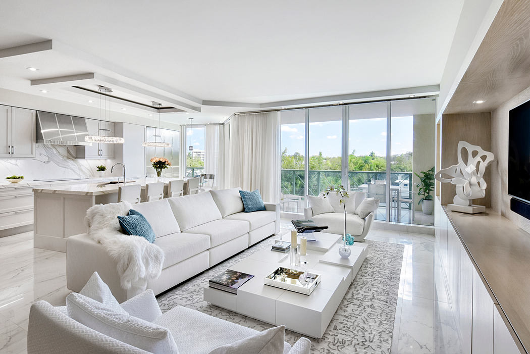 Spacious modern living room with large windows, sleek furniture, and minimalist decor.
