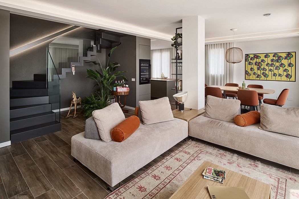 Spacious open-concept living area with modern furniture, artwork, and natural elements.