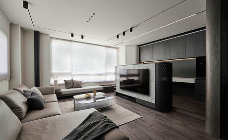 Modern living room with sleek gray furniture, minimalist TV console, and recessed lighting.