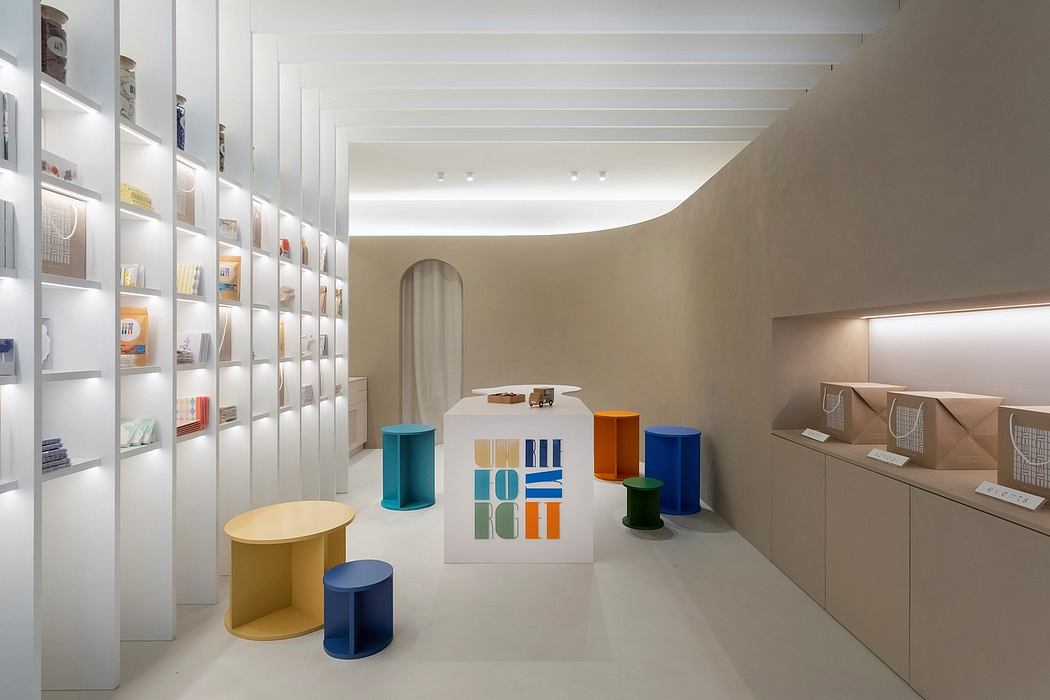 Minimalist retail space with modular furniture and color-blocked display shelves.