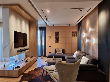 Sleek, modern living room with wood paneling, track lighting, and built-in TV cabinet.