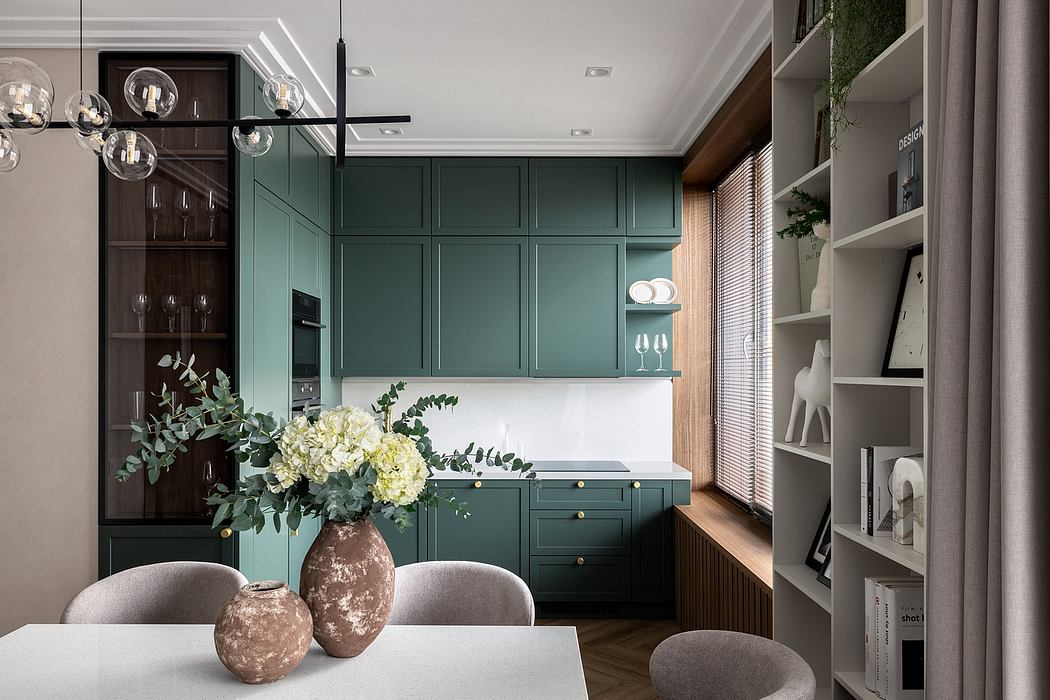 Elegant kitchen with wooden floors, lush greenery, and modern gray furnishings.