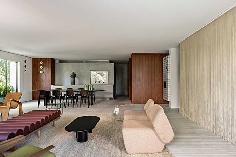 Sleek, modern interior with minimalist furniture, neutral tones, and natural materials.