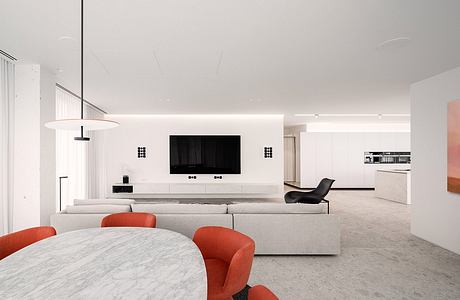 Minimalist living room with sleek furniture, marble table, and recessed wall-mounted TV.