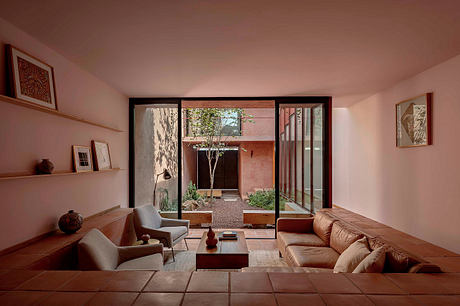 Warm-toned interior with wooden accents, open courtyard, and a minimalist, nature-inspired design.
