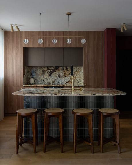 Sleek modern kitchen with granite countertops, wood paneling, and pendant lighting.
