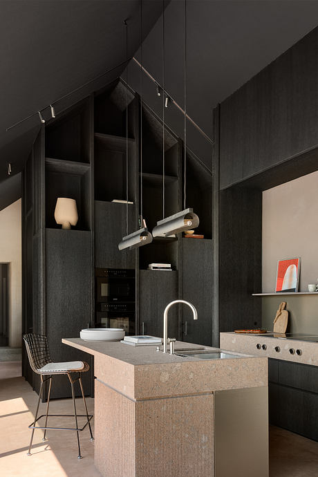 A modern, minimalist kitchen with dark cabinetry, concrete countertops, and sleek lighting fixtures.