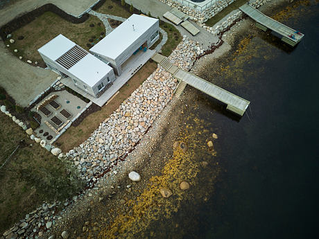 Striking architectural design featuring modern structures, stone pathways, and natural elements.