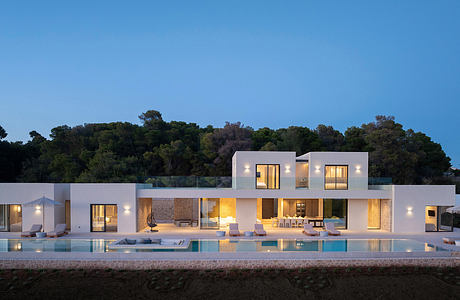 Sleek, modern villa with clean lines, thoughtful lighting, and expansive outdoor living space.