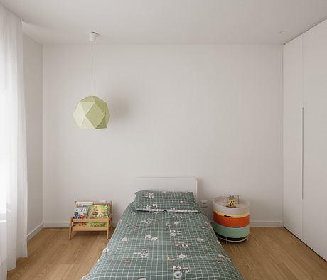 Sparse, modern bedroom with geometric light fixture and grid-patterned bedding.