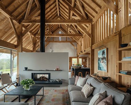 Rustic wooden beams and walls create a warm, cozy atmosphere in this modern living space.