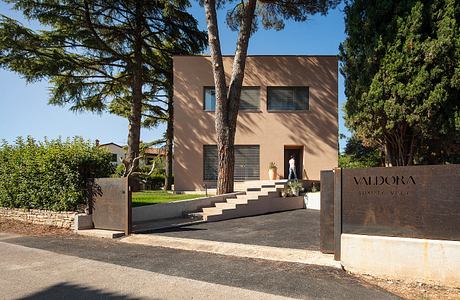 Modern villa with sleek, minimalist architecture, clean lines, and lush surroundings.