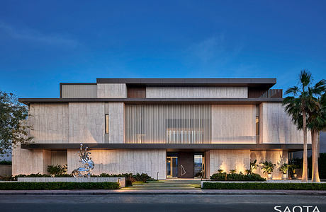 Striking modern building with layered facades, wooden accents, and sculptural elements.