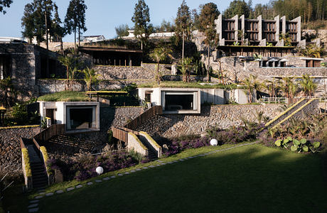 Striking architectural design with steps, terraces, and lush vegetation.