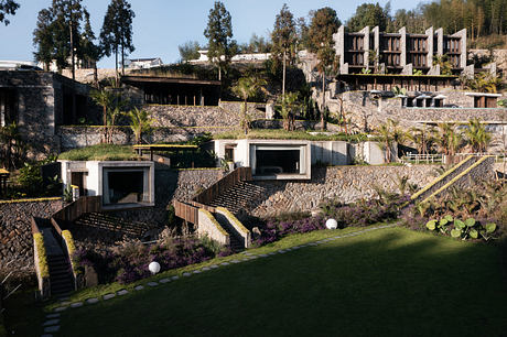 Striking architectural design with steps, terraces, and lush vegetation.