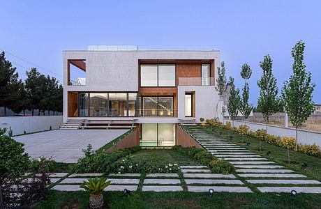 Striking modern home with clean lines, wood accents, and well-designed landscaping.