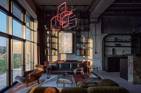 A sleek, industrial-style living space with bold neon lighting and an eclectic mix of furnishings.