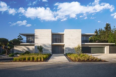 Sleek, modern home with clean lines, minimalist landscaping, and a bold architectural style.