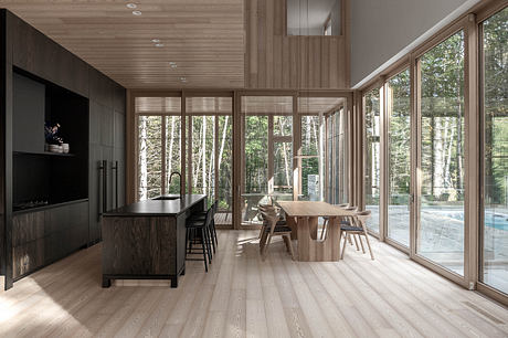 Spacious, minimalist interior with large windows overlooking lush forest, wooden accents.
