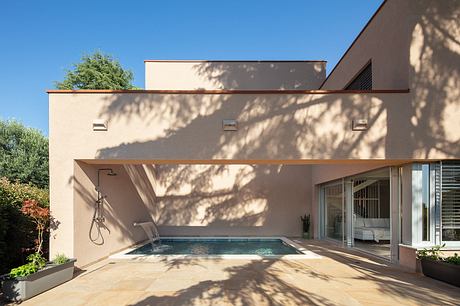 Modern architectural design with sleek lines, an inviting pool, and stylish outdoor lighting.