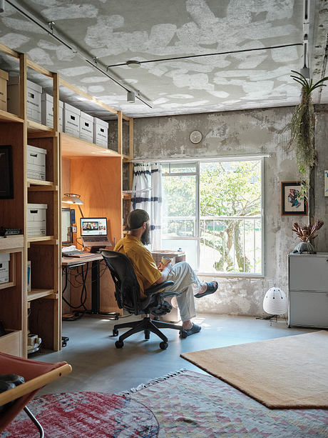 Cozy home office with rustic shelves, textured walls, and natural elements.