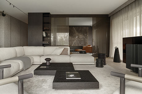 Monochromatic living room with sleek modern furnishings, textured walls, and minimalist decor.