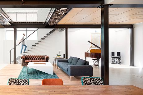 Spacious, modern industrial-style interior with distinct architectural features.