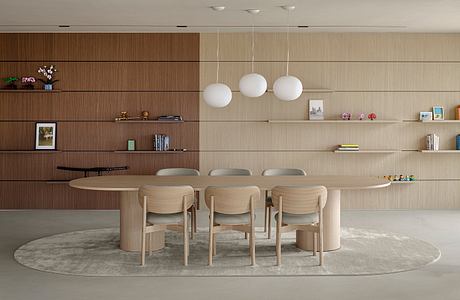 Minimalist dining room with wooden panels, floating shelves, and pendant lighting.