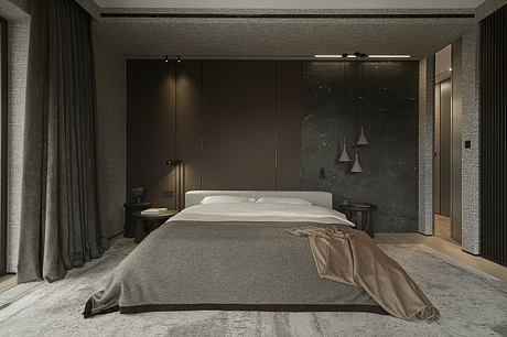 Minimalist bedroom with sleek dark furniture, textured walls, and pendant lighting.