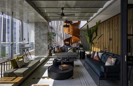 Sophisticated industrial-chic interior with bold architectural elements and modern furnishings.