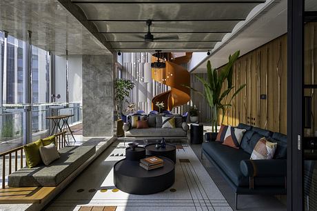 Sophisticated industrial-chic interior with bold architectural elements and modern furnishings.