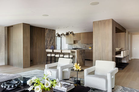 Sleek, contemporary interior design featuring wood paneling, modern lighting, and open floor plan.