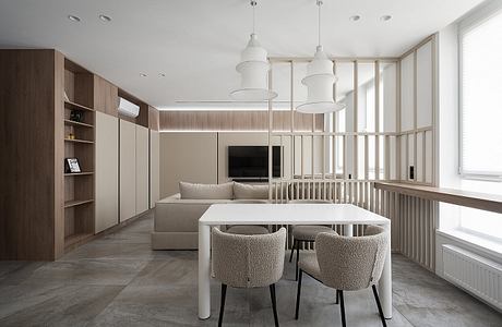 Minimalist living room with neutral tones, clean lines, and modern lighting fixtures.