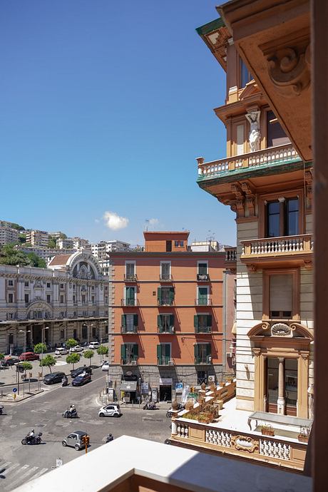 Ornate architectural details and vibrant urban streetscape in a sunny southern European city.