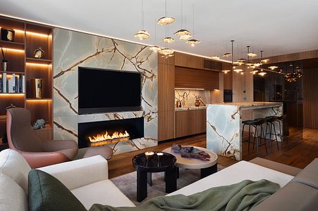 Luxurious living room with modern fireplace, marble wall, and intricate lighting.