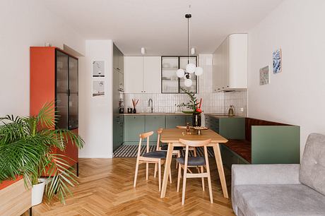 Modern, open-plan kitchen and dining area with geometric patterns, natural wood, and vibrant accents.