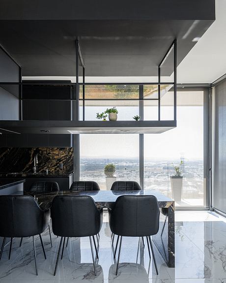 Sleek, modern kitchen with floor-to-ceiling windows showcasing stunning city views.