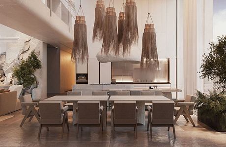 A contemporary dining room with a sculptural lighting fixture and a sleek, minimalist design.